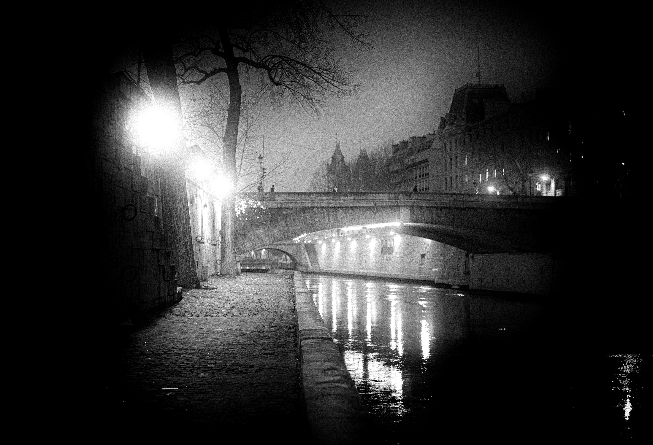 A black and white noir canal at night
