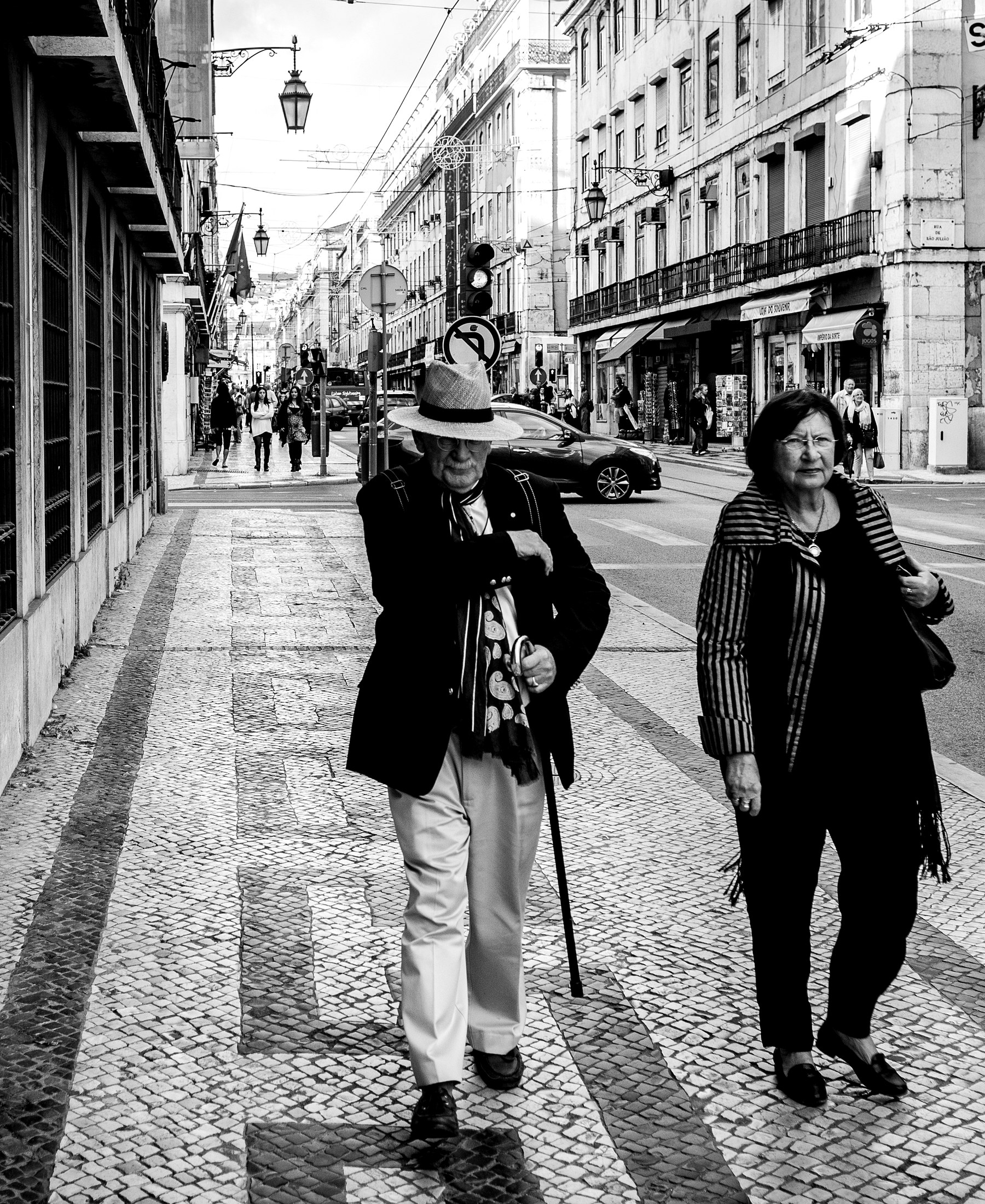 A black and white editorial street fashion scene