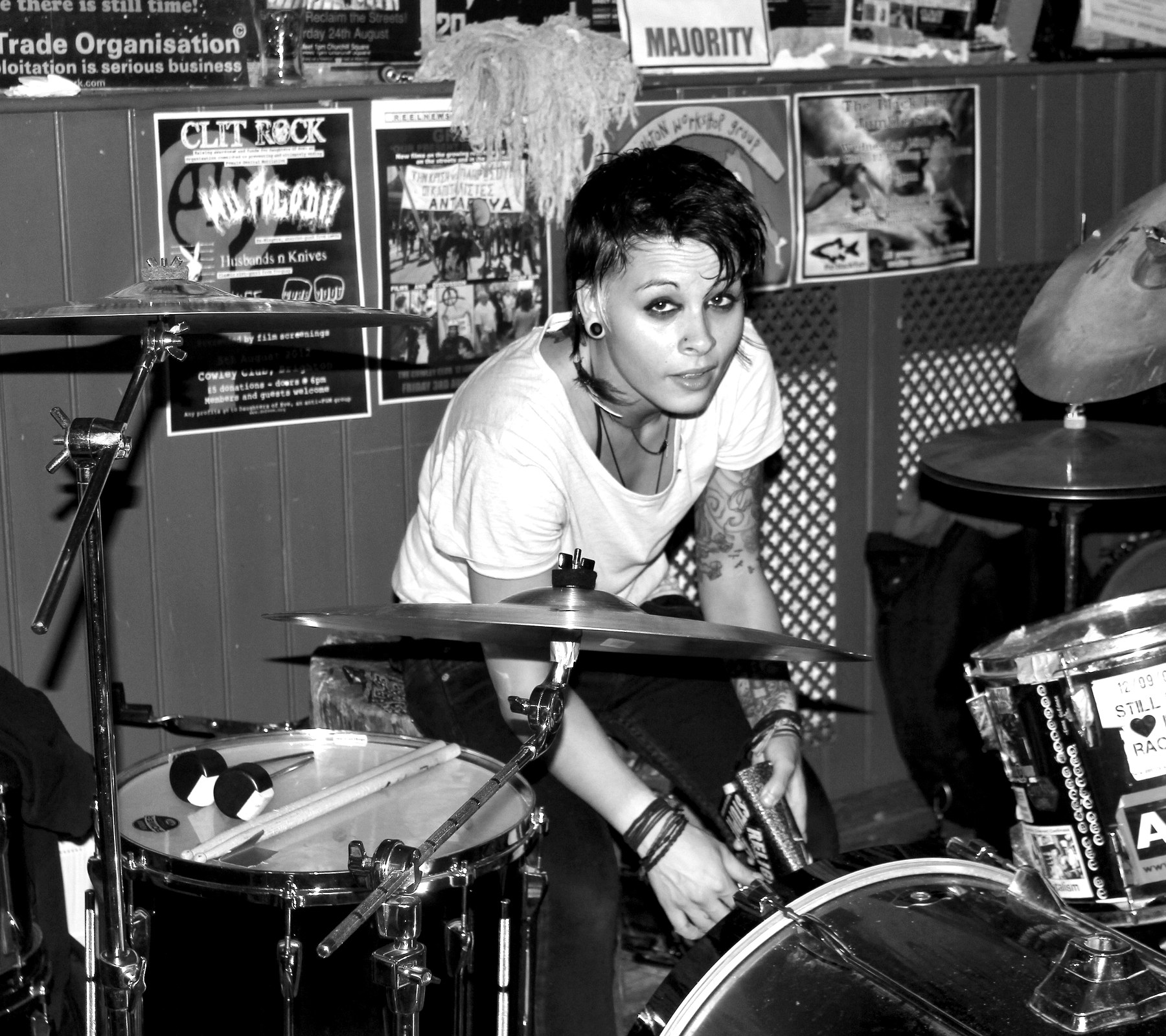 A black and white punk drum room portrait